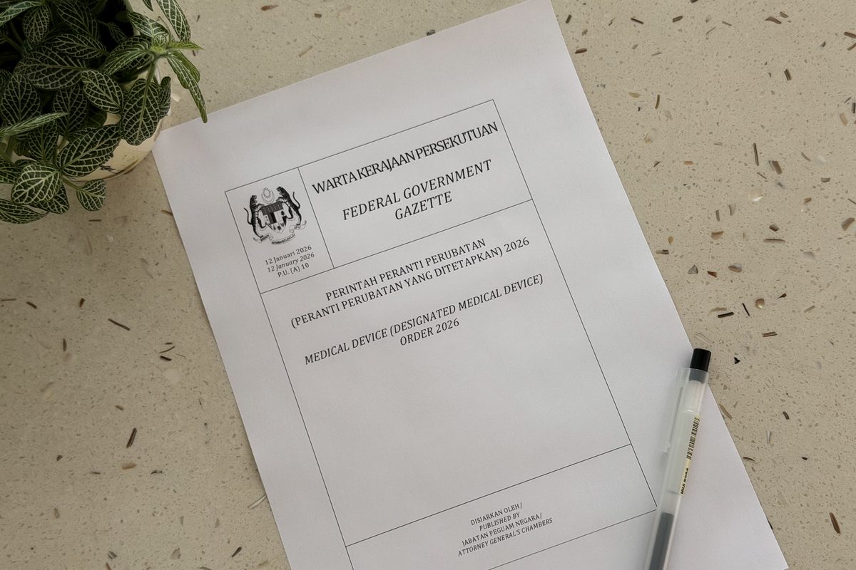 The printed cover of Malaysia's Federal Government Gazette for the Medical Device (Designated Medical Device) Order 2026, on a desk in daylight.