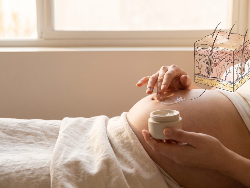 A folded soft cotton blanket beside a small ceramic bowl of plain moisturiser on pale wood in warm window light, a still life with no text, faces, needles or product packaging