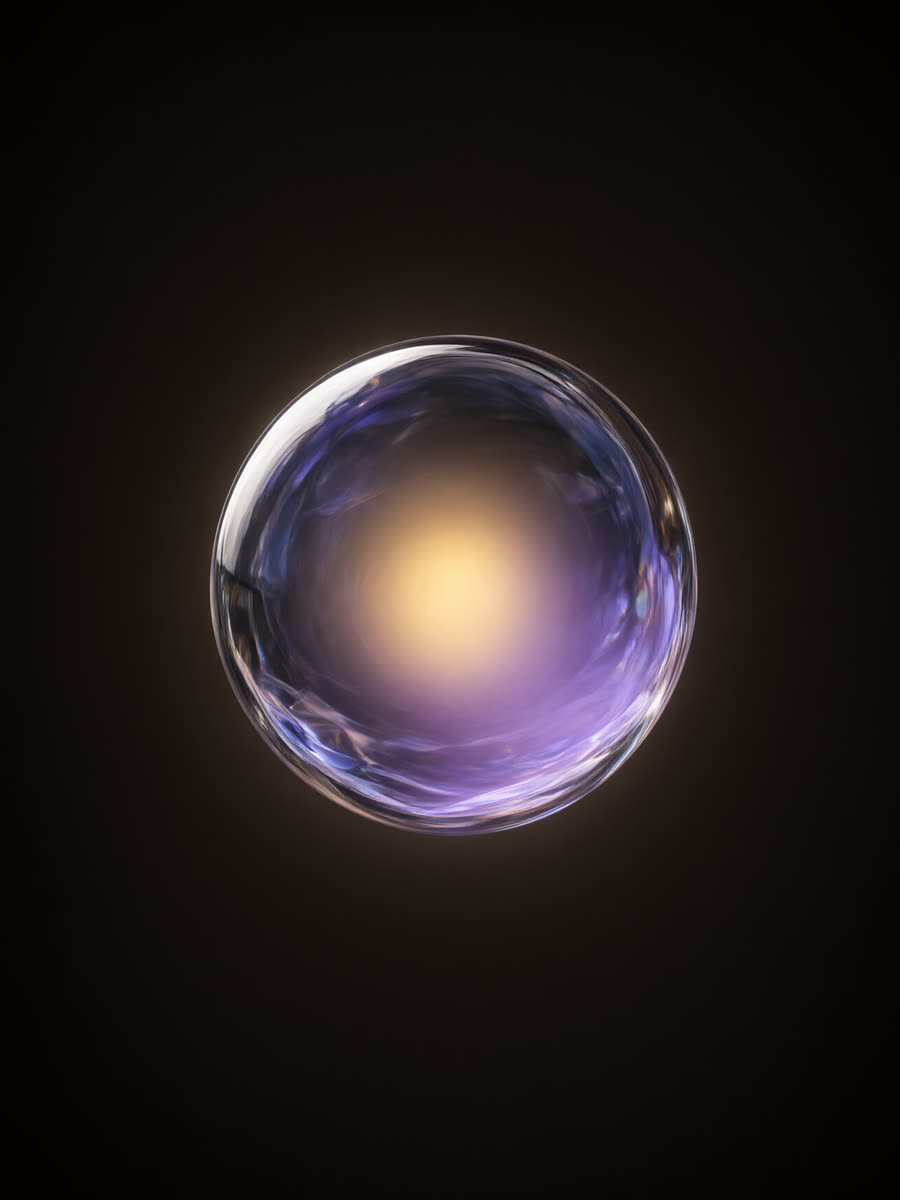 A glowing translucent glass sphere on a dark ground