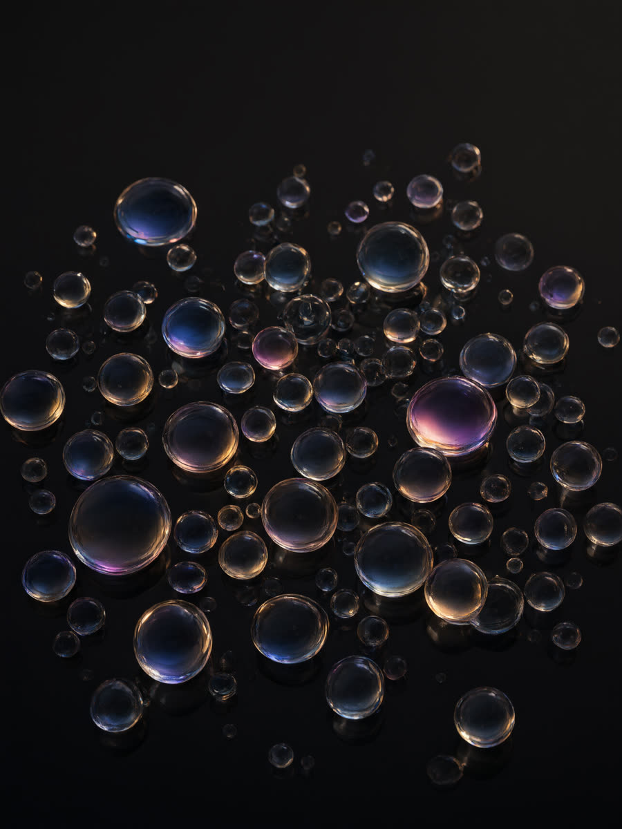 A loose scatter of small translucent glass droplets
